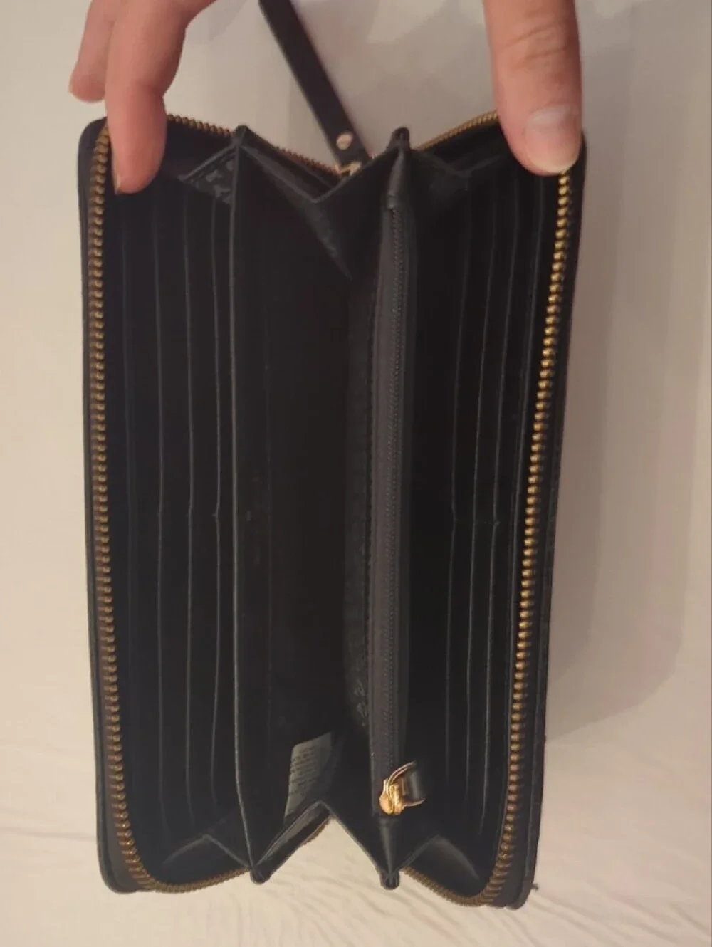 kate spade black pebbled leather tassel zip wallet
